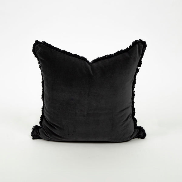 The dark and stormy velvet and fringe midnight colored throw pillow product shot Galey Alix